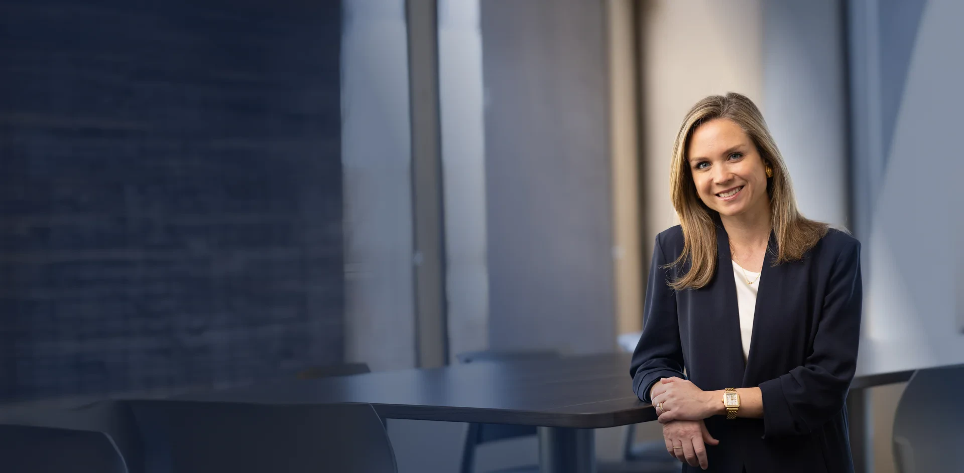 Mary Hunter - Professional in business attire smiling in an office setting