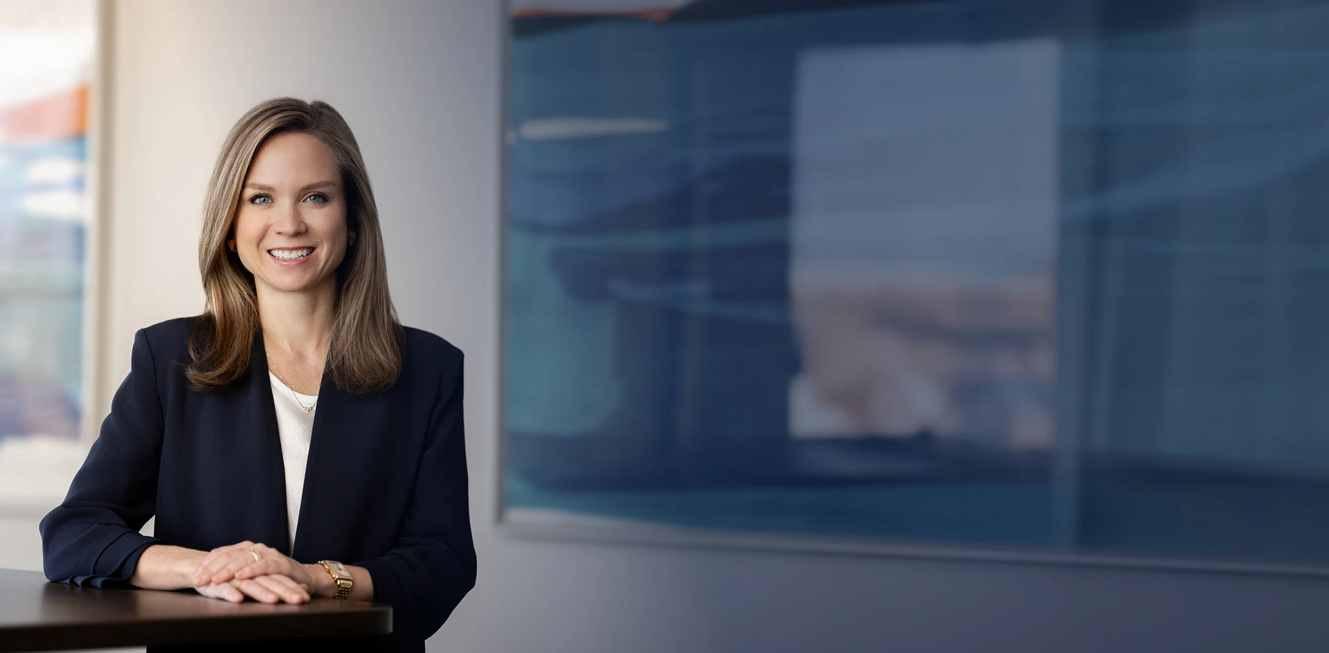 Mary Hunter - Professional in business attire smiling in an office setting