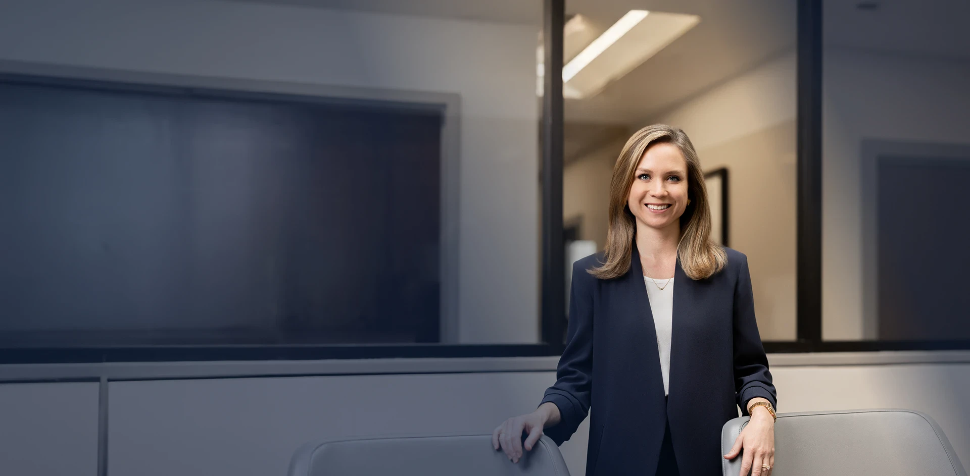 Mary Hunter - Professional in business attire smiling in an office setting